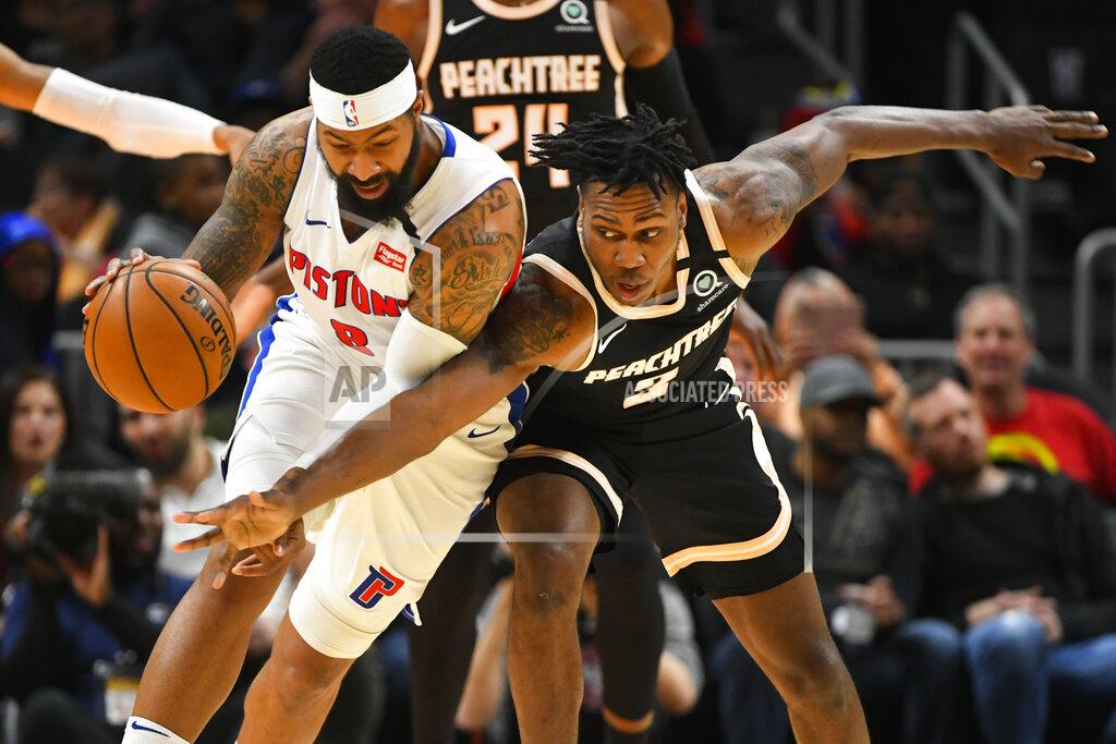 John Amis Atlanta Hawks guard Treveon Graham, right, reaches in against Detroit Pistons forward Markieff Morris, left, during the second half of an NBA basketball game Saturday, Jan. 18, 2020, in Atlanta. (AP Photo/John Amis)