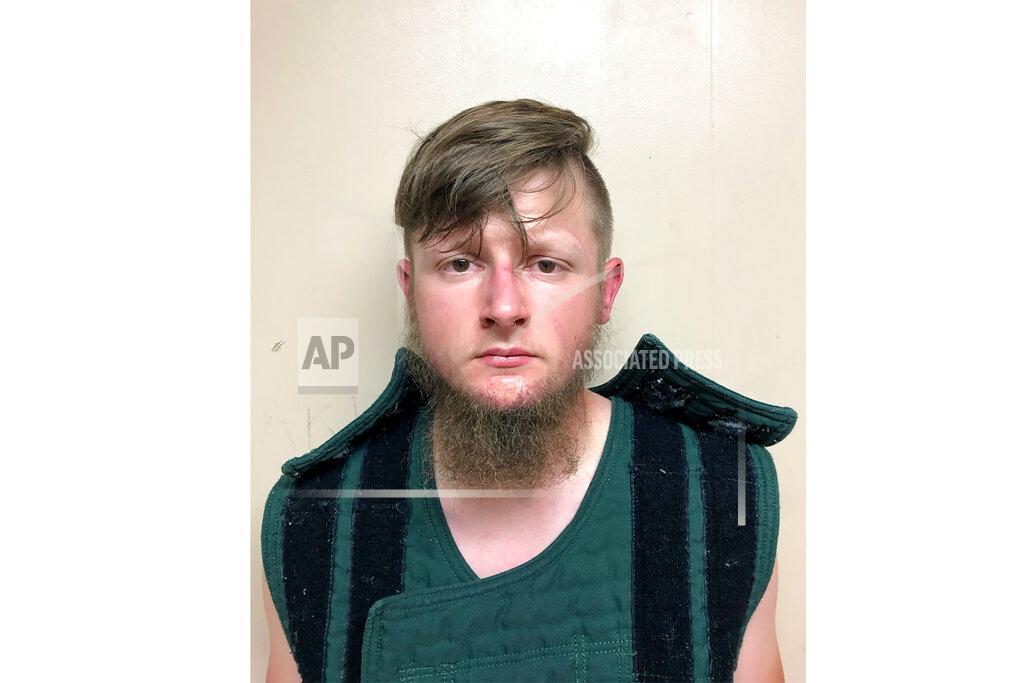 Uncredited FILE - This March 16, 2021, booking photo provided by the Crisp County, Ga., Sheriff's Office shows Robert Aaron Long. A man accused of killing eight people at three Atlanta-area massage businesses pleaded guilty in Cherokee County on Tuesday, July 27, 2021, hoping for a sentence of life without parole to the first four of the shooting deaths. Robert Aaron Long faces still faces the death penalty if convicted in four more shooting deaths in Atlanta, where he faces charges of domestic terrorism with a hate crime enhancement in addition to murder. (Crisp County Sheriff's Office via AP, File)