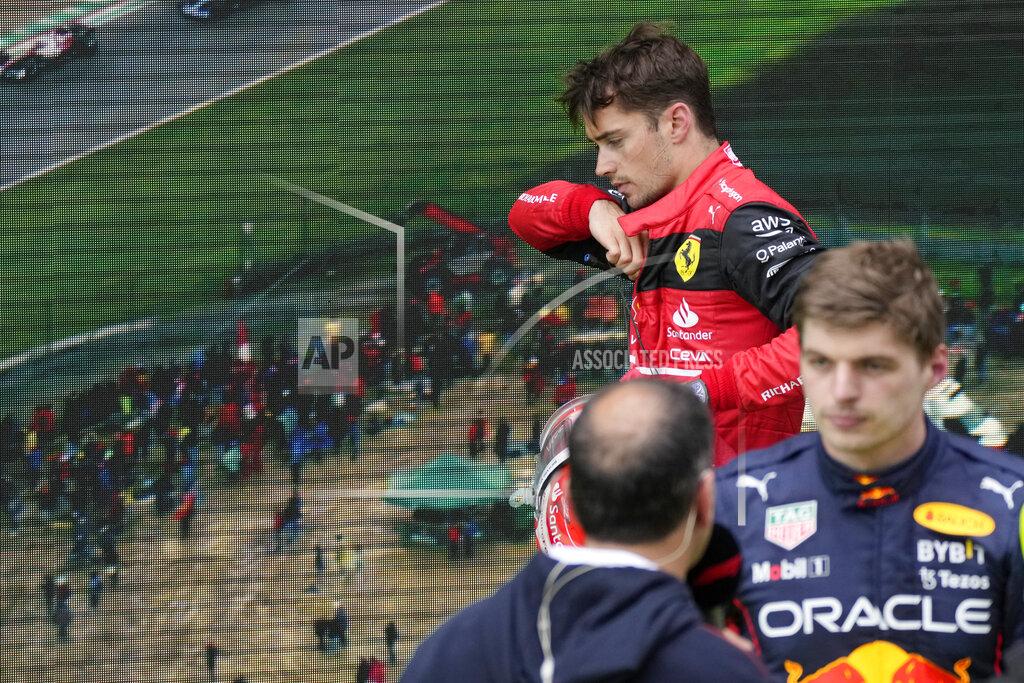 Luca Bruno Ferrari driver Charles Leclerc, top, of Monaco, walks past next to Red Bull driver Max Verstappen of the Netherlands at the end of the Emilia Romagna Formula One Grand Prix, at the Enzo and Dino Ferrari racetrack, in Imola, Italy, Sunday, April 24, 2022. (AP Photo/Luca Bruno)