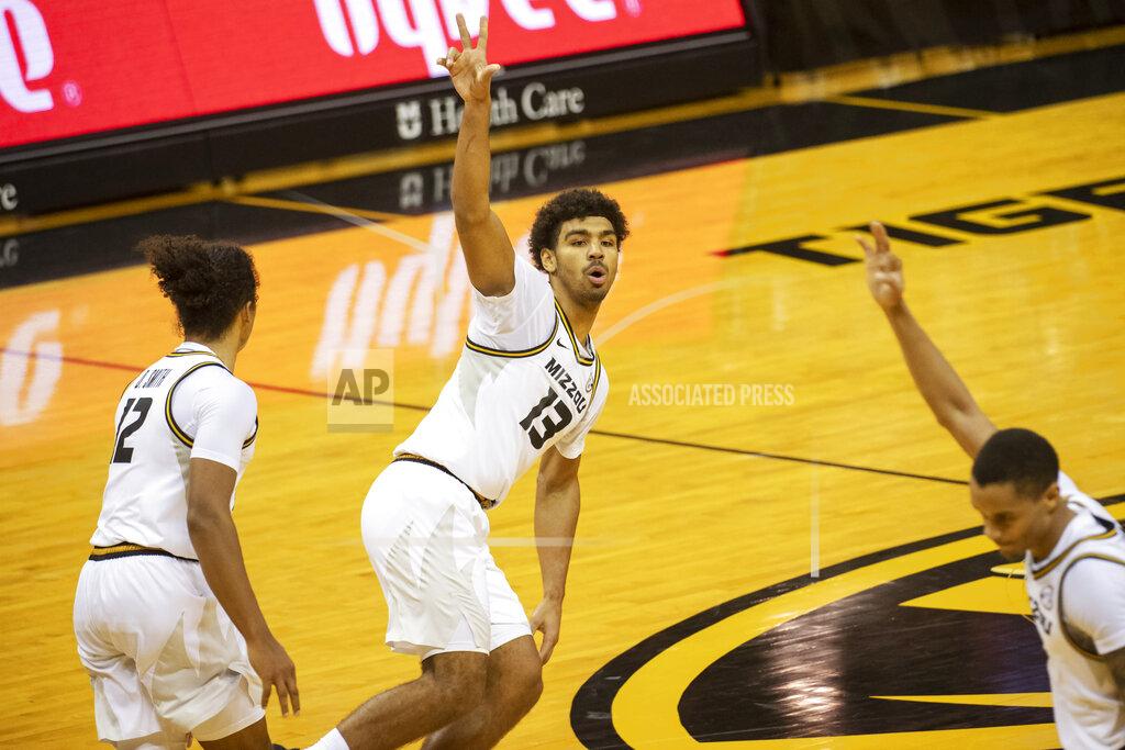 L.g. Patterson Missouri's Mark Smith, center, celebrates a 3-point basket with teammates during the second half of an NCAA college basketball game against Oral Roberts on Wednesday, Nov. 25, 2020, in Columbia, Mo. (AP Photo/L.G. Patterson)