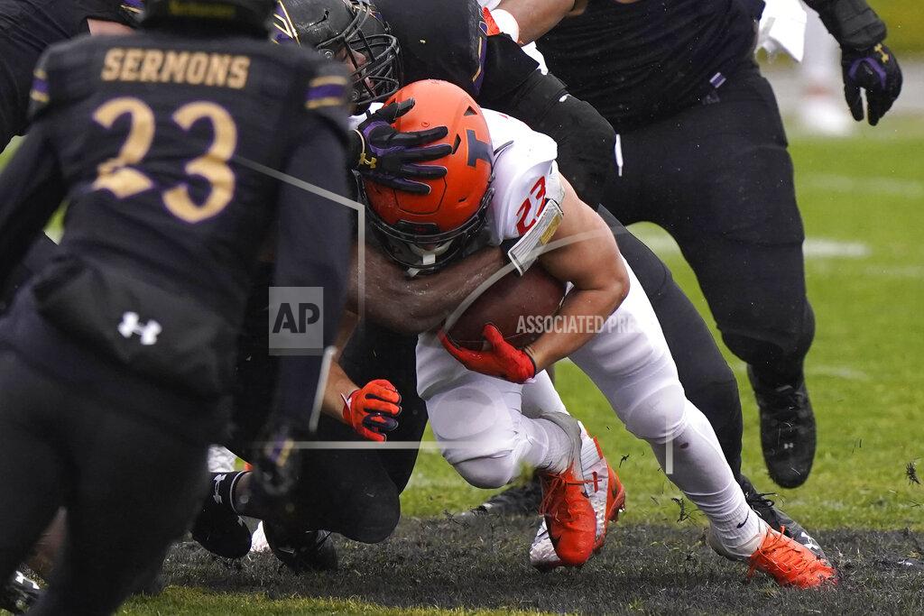 Nam Y. Huh Illinois running back Conner Lillig (23) is tackled by Northwestern defenders during the second half of an NCAA college football game in Evanston, Ill., Saturday, Dec. 12, 2020. Northwestern won 28-10. (AP Photo/Nam Y. Huh)