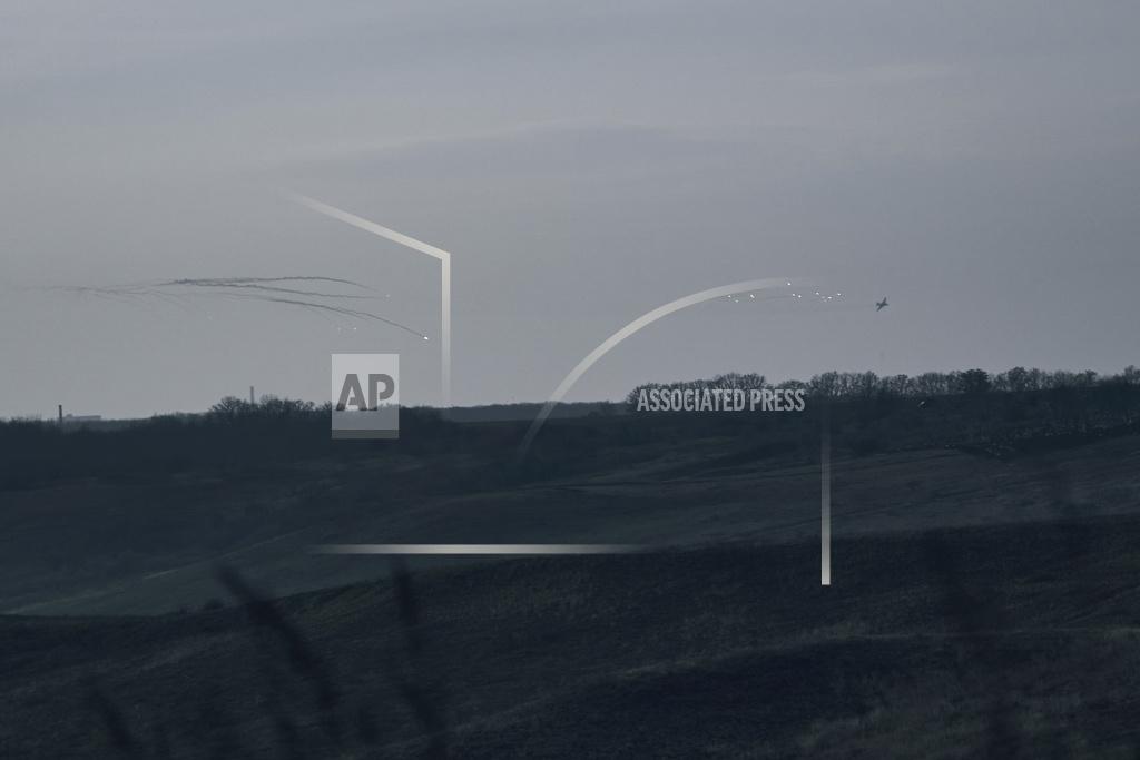 Libkos A fighter jet flies above the frontline near Bakhmut, Donetsk region, Ukraine, Thursday, Nov. 24, 2022. (AP Photo/LIBKOS)