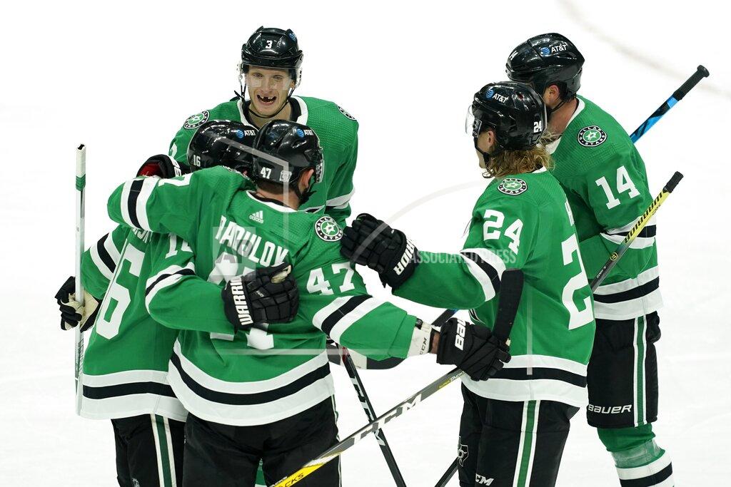 Tony Gutierrez Dallas Stars' John Klingberg (3), Joe Pavelski (16), Roope Hintz (24) and Jamie Benn (14) celebrate with Alexander Radulov (47) following his goal in the second period of an NHL hockey game against the Nashville Predators in Dallas, Friday, Jan. 22, 2021. (AP Photo/Tony Gutierrez)