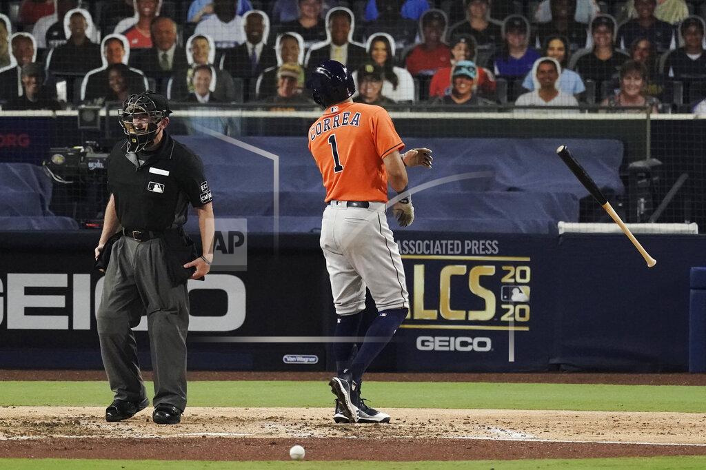 Jae C. Hong Houston Astros Carlos Correa tosses his bat and has words with home plate umpire Lance Barksdale after striking out during the fourth inning in Game 7 of a baseball American League Championship Series, Saturday, Oct. 17, 2020, in San Diego. (AP Photo/Jae C. Hong)