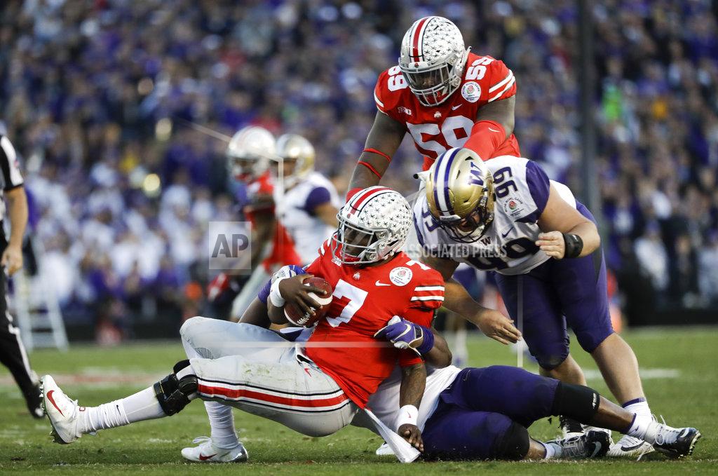 Marcio Jose Sanchez Ohio State quarterback Dwayne Haskins is sacked by Washington defensive lineman Levi Onwuzurike during the second half of the Rose Bowl NCAA college football game Tuesday, Jan. 1, 2019, in Pasadena, Calif. (AP Photo/Marcio Jose Sanchez)