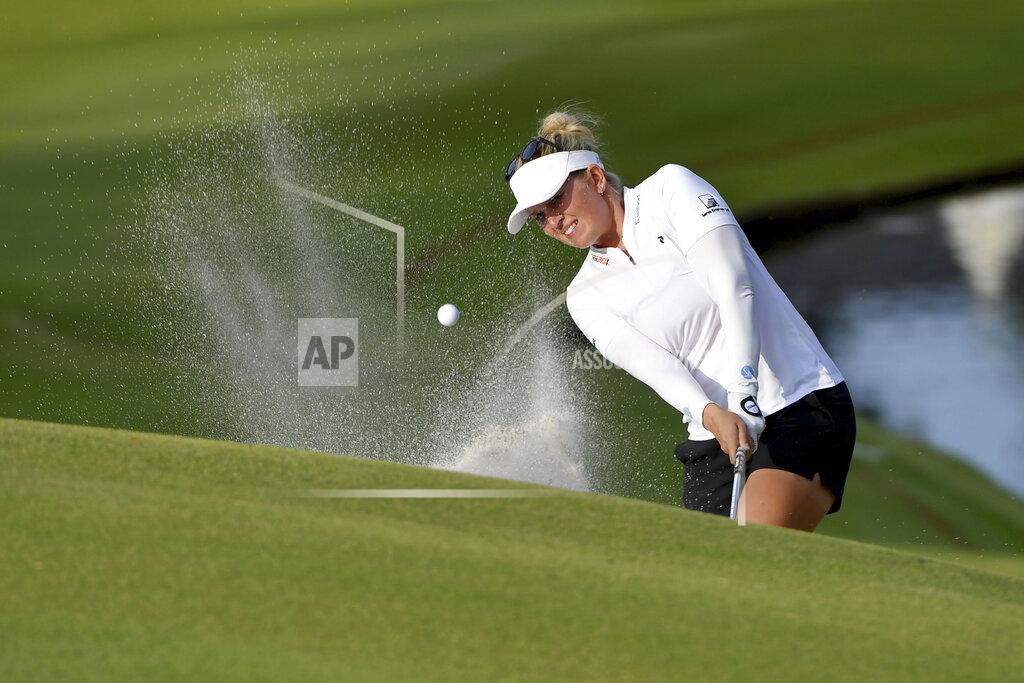 Michael Woods Nanna Koerstz Madsen of Denmark, chips onto the 18th green during the first round of the LPGA Walmart NW Arkansas Championship golf tournament, Friday, Sept. 24, 2021, in Rogers, Ark. (AP Photo/Michael Woods)