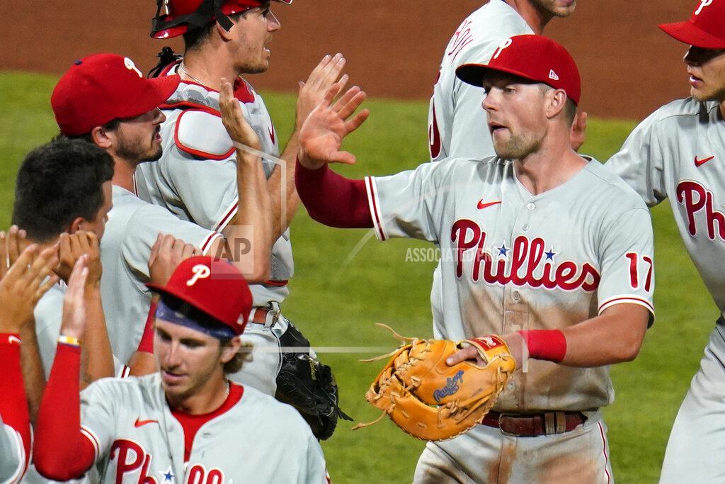 Gene J. Puskar Philadelphia Phillies' Rhys Hoskins (17) and teammates celebrate a 4-2 win over the Pittsburgh Pirates in 10 innings in a baseball game in Pittsburgh, Friday, July 29, 2022. (AP Photo/Gene J. Puskar)