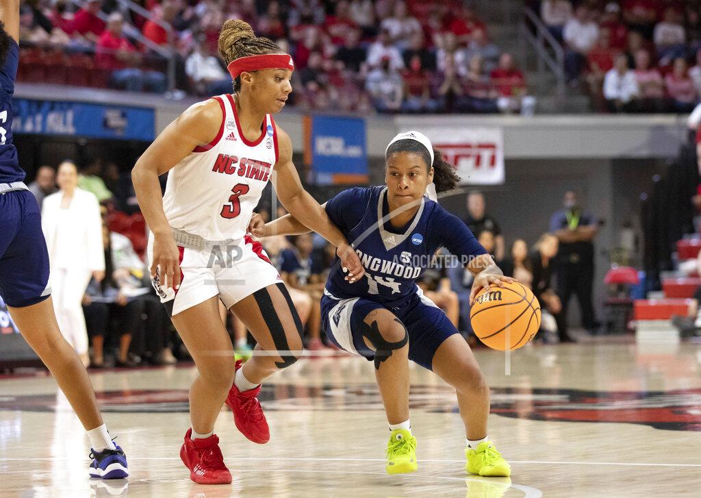 Ben Mckeown Longwood's Tra'Dayja Smith (14) handles the ball as North Carolina State's Kai Crutchfield (3) defends during the first half of a college basketball game in the first round of the NCAA tournament in Raleigh, N.C., Saturday, March 19, 2022. (AP Photo/Ben McKeown)
