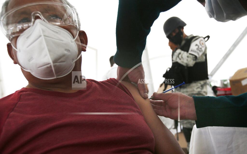 Marco Ugarte An elderly man gets his Sinovac Biotech COVID-19 vaccine at the Americas sports center in Ecatepec, a borough on the outskirts of Mexico City, Tuesday, Feb. 23, 2021. (Foto AP/Marco Ugarte