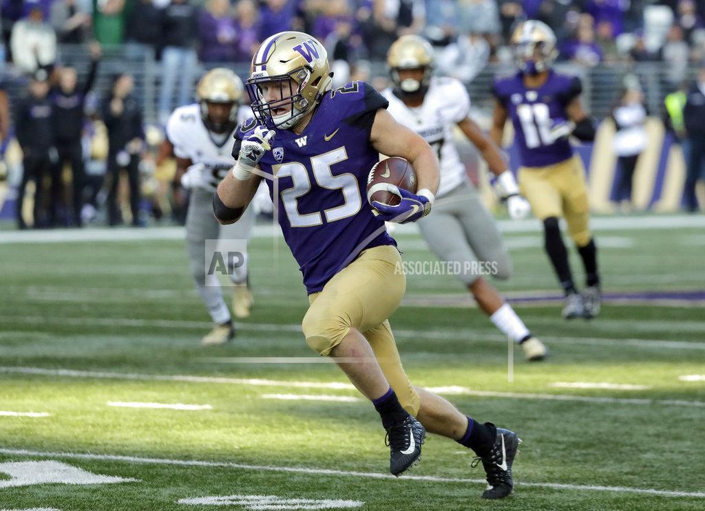Ted S. Warren Washington linebacker Ben Burr-Kirven (25) runs after he intercepted a pass thrown by Colorado quarterback Steven Montez during the second half of an NCAA college football game, Saturday, Oct. 20, 2018, in Seattle. Washington won 27-13. (AP Photo/Ted S. Warren)