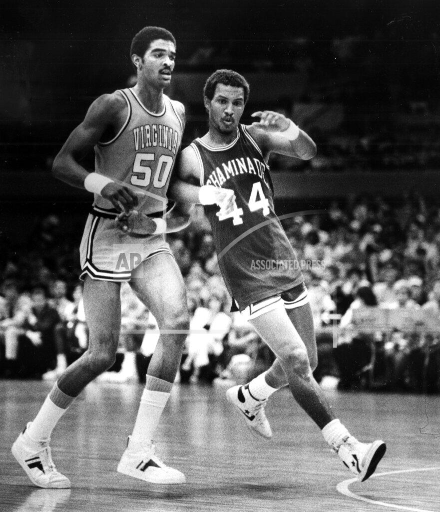 FILE - In this Dec. 23, 1982, file photo, Chaminade's Tony Randolph attempts to edge Virginia's Ralph Sampson, left, out of the play during a college basketball game in Honolulu. Virginia's basketball program, which gave us one of the sport's greatest players in Sampson and its two biggest upsets, by Division II Chaminade and the world's most famous 16 seed in UMBC, is now on the verge of writing a new chapter _ one that would nott be appreciated by nearly as many people were it not for the huge platform Virginia hoops helped create. (AP Photo/File)