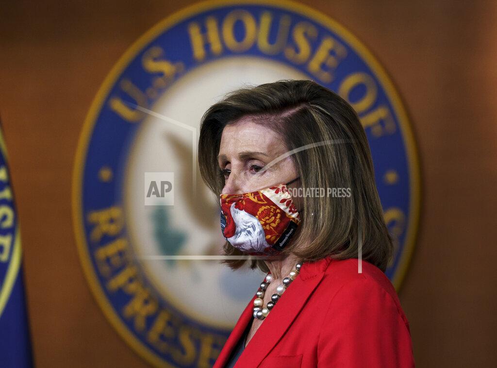 J. Scott Applewhite FILE - In this Nov. 6, 2020, file photo Speaker of the House Nancy Pelosi, D-Calif., pauses as she meets with reporters about the impact of the election on the political landscape in Congress, at the Capitol in Washington. President Donald Trump lost the presidency and Democrat Joe Biden will move into the White House in January after winning nearly 80 million votes nationwide, a historic high. But the enthusiasm for Biden, or for removing Trump, didn't trickle down to other Democrats down ballot. That leaves the party confronting a reckoning over how to move forward. The Democratic Congressional Campaign Committee is beginning a “deep dive” examination into what happened. (AP Photo/J. Scott Applewhite, File)