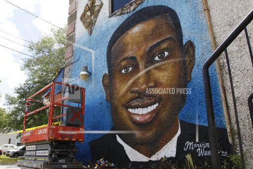 FILE - A painted mural of Ahmaud Arbery is displayed on May 17, 2020, in Brunswick, Ga., where the 25-year-old man was shot and killed in February. Arbery was shot and killed by two men who told police they thought he was a burglar. (AP Photo/Sarah Blake Morgan, file)