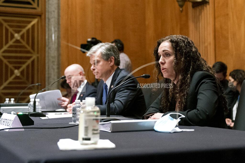 Greg Nash Secretary of Homeland Security Alejandro Mayorkas, left, FBI Director Christopher Wray, center, and Director of the National Counterterrorism Center Christine Abizaid, testify before a Senate Homeland Security and Governmental Affairs Committee hearing to discuss security threats 20 years after the 9/11 terrorist attacks, Tuesday, Sept. 21, 2021 on Capitol Hill in Washington. (Greg Nash/Pool via AP)