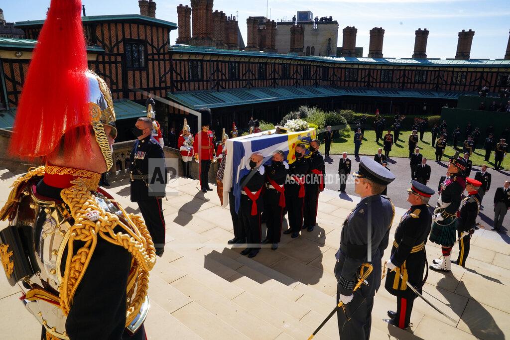 Arthur Edwards The coffin is held on the steps of St George's Chapel during the procession of Britain Prince Philip's funeral at Windsor Castle, Windsor, England, Saturday April 17, 2021. Prince Philip died April 9 at the age of 99 after 73 years of marriage to Britain's Queen Elizabeth II. (Arthur Edwards/Pool via AP)