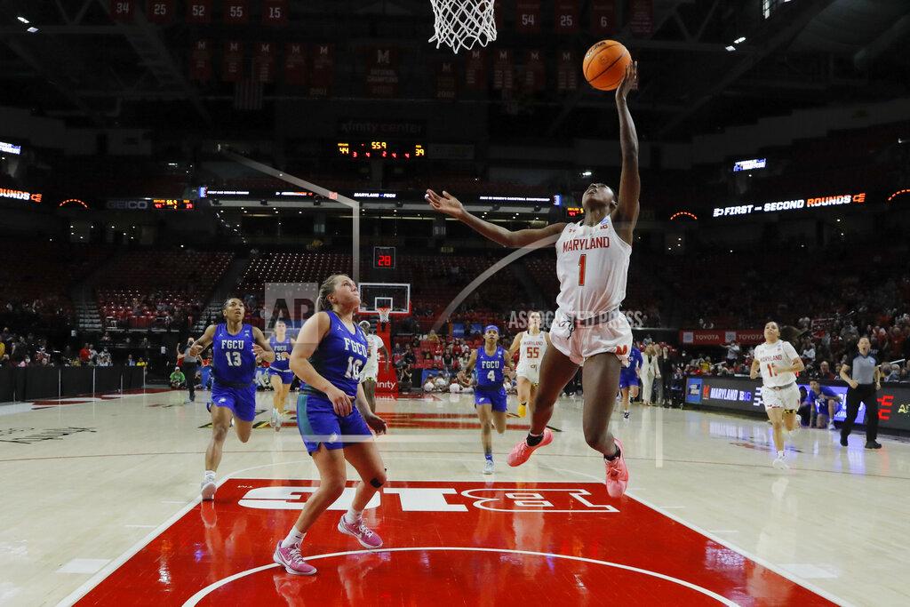 Julio Cortez Maryland guard Diamond Miller (1) goes up for a shot as Florida Gulf Coast guard Kendall Spray (10) looks on during the first half of a college basketball game in the second round of the NCAA tournament, Sunday, March 20, 2022, in College Park, Md. Maryland won 89-65. (AP Photo/Julio Cortez)