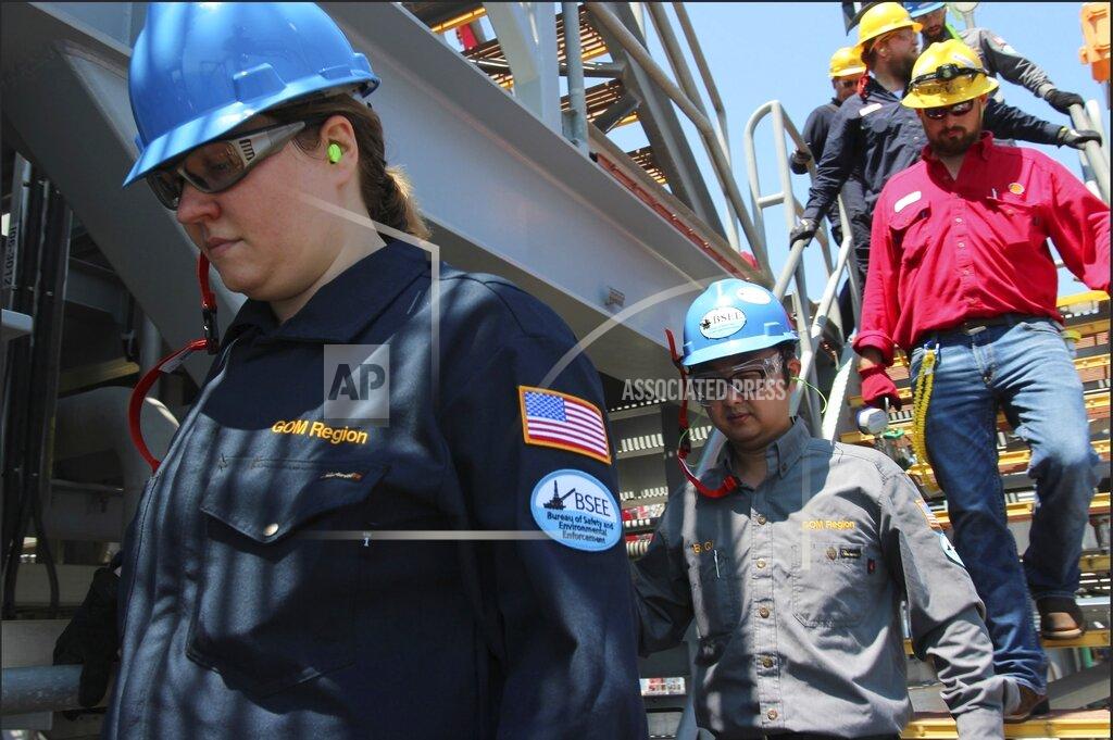 Uncredited In this July 24, 2018, photo released by the U.S. Bureau of Safety and Environmental Enforcement, engineers from the bureau inspect an oil platform in the Gulf of Mexico. Inspection visits have been declining in the years since the Deepwater Horizon accident killed 11 people and spilled 134 million gallons of oil in the Gulf. (U.S. Bureau of Safety and Environmental Enforcement via AP)