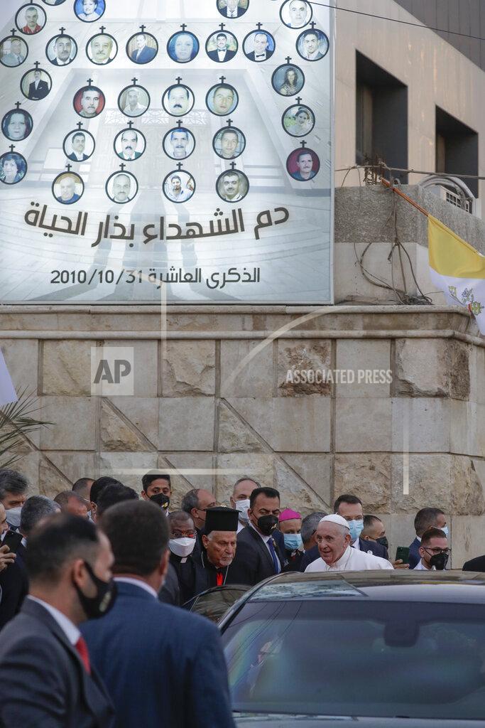 Andrew Medichini Pope Francis leaves the Sayidat al-Nejat (Our Lady of Salvation) Cathedral, in Baghdad, Iraq, Friday, March 5, 2021. Pope Francis has arrived in Iraq to urge the country's dwindling number of Christians to stay put and help rebuild the country after years of war and persecution, brushing aside the coronavirus pandemic and security concerns. (AP Photo/Andrew Medichini)