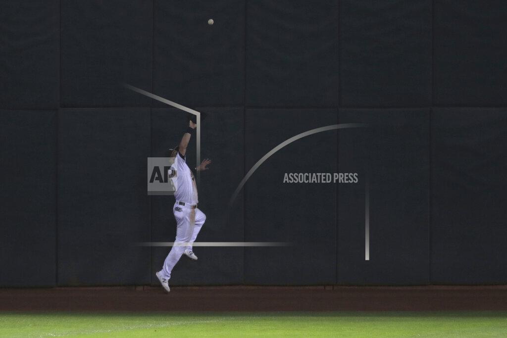 Oakland Athletics' Robbie Grossman catches a ball hit by Seattle Mariners' Joseph Odom during the eighth inning of a baseball game in Oakland, Calif., Friday, Sept. 25, 2020. (AP Photo/Jed Jacobsohn)