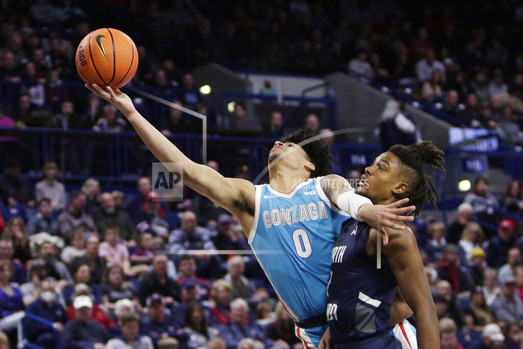 Young Kwak Gonzaga guard Julian Strawther, left, shoots while defended by North Florida guard Chaz Lanier during the second half of an NCAA college basketball game, Monday, Nov. 7, 2022, in Spokane, Wash. Gonzaga won 104-63. (AP Photo/Young Kwak)
