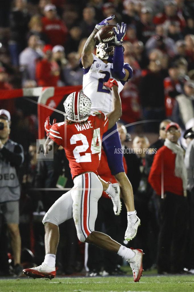 Jae C. Hong Washington wide receiver Aaron Fuller catches a pass over Ohio State cornerback Shaun Wade during the second half of the Rose Bowl NCAA college football game Tuesday, Jan. 1, 2019, in Pasadena, Calif. (AP Photo/Jae C. Hong)