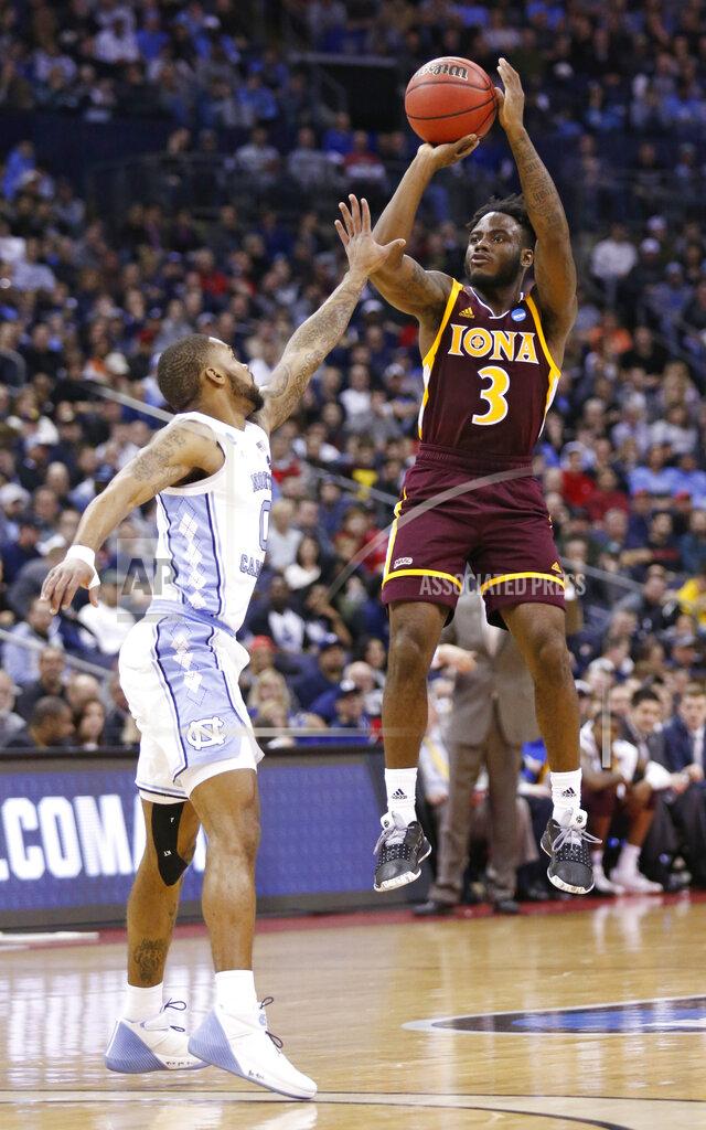 Paul Vernon Iona's Asante Gist (3) shoots over North Carolina's Seventh Woods (0) in the first half during a first round men's college basketball game in the NCAA Tournament in Columbus, Ohio, Friday, March 22, 2019. (AP Photo/Paul Vernon)
