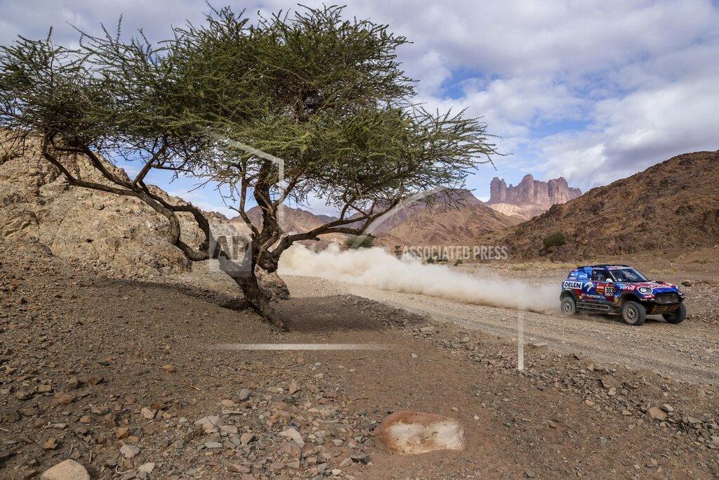 Bernat Armangue Driver Jakub Przygonski, of Poland, and co-driver Timo Gottschalk, of Germany, race their Mini during stage four of the Dakar Rally between Neom and Al Ula, in Saudi Arabia, Wednesday, Jan. 8, 2020. (AP Photo/Bernat Armangue)