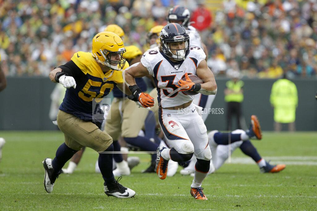 Mike Roemer Denver Broncos running back Phillip Lindsay, right, runs with the ball as Green Bay Packers inside linebacker Blake Martinez (50) defends during the first half of an NFL football game Sunday, Sept. 22, 2019, in Green Bay, Wis. (AP Photo/Mike Roemer)