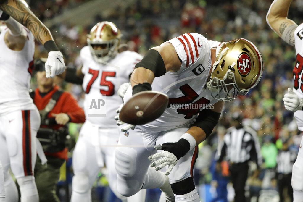 Ted S. Warren San Francisco 49ers' Joe Staley spikes the football after a touchdown run by Raheem Mostert against the Seattle Seahawks during the second half of an NFL football game, Sunday, Dec. 29, 2019, in Seattle. (AP Photo/Ted S. Warren)