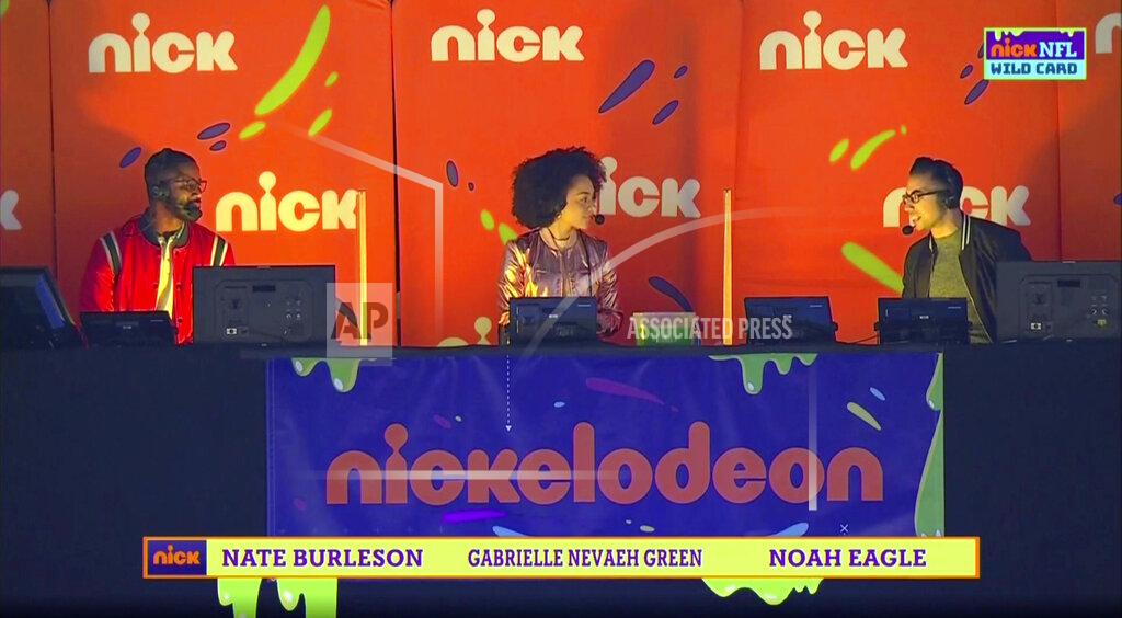 Uncredited Nate Burleson, Gabrielle Nevaeh Green and Noah Eagle are part of Nickelodeon's kid-focused broadcast of the NFL wild-card playoff game between the Chicago Bears and New Orleans Saints at the Superdome, Sunday, Jan. 10, 2021 in New Orleans. The positive reviews for Nickelodeon's kids-focused broadcast of last Sunday's NFL playoff game showed the potential of alternate broadcasts of sporting events. The success of that broadcast has led to many wondering what other sports it could expand to and when we might see it again in the NFL? (CBS/Viacom via AP)