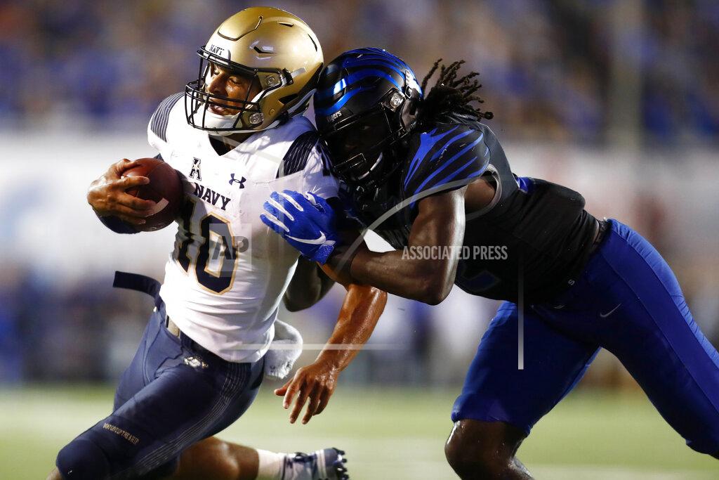 Joe Rondone Memphis defensive back Tyrez Lindsey tackles Navy quarterback Malcolm Perry during an NCAA college football game in Memphis, Tenn., Thursday, Sept. 26, 2019. (Joe Rondone/The Commercial Appeal via AP)