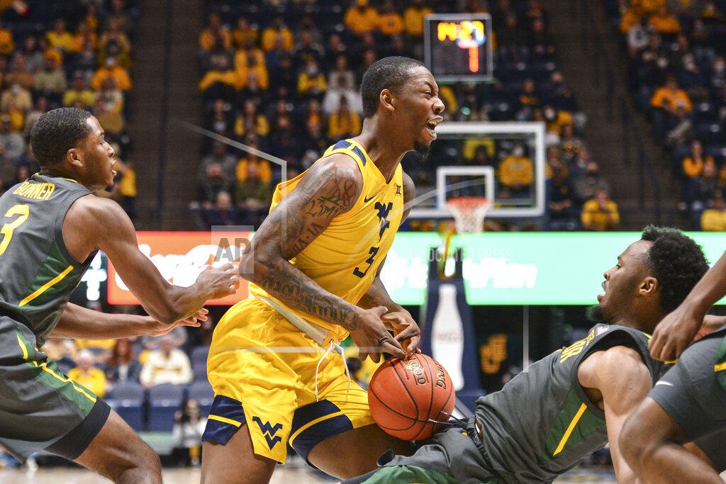 William Wotring Baylor guard LJ Cryer (4) is called for a foul while guarding West Virginia forward Gabe Osabuohien (3) during the first half of an NCAA college basketball game in Morgantown, W.Va., Tuesday, Jan. 18, 2022. (William Wotring)