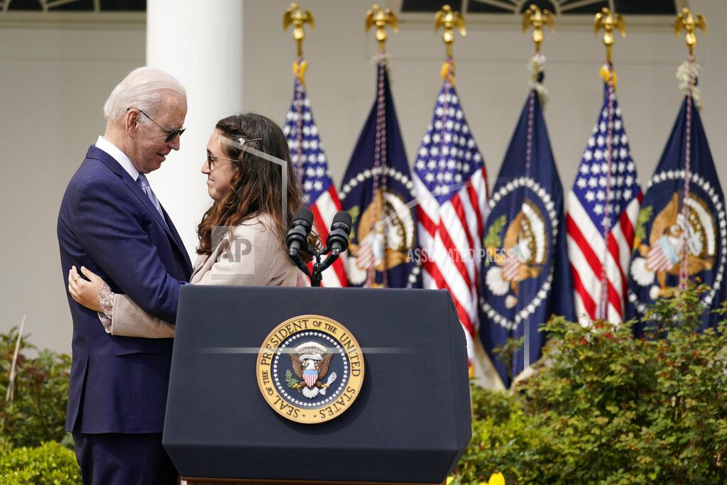 Carolyn Kaster FILE - President Joe Biden hugs Mia Tretta, a survivor of the Saugus Hight School shooting in Santa Clarita, Calif., after she spoke in the Rose Garden of the White House in Washington, April 11, 2022. Biden announced a final version of the administration's ghost gun rule, which comes with the White House and the Justice Department under growing pressure to crack down on gun deaths. (AP Photo/Carolyn Kaster, File)