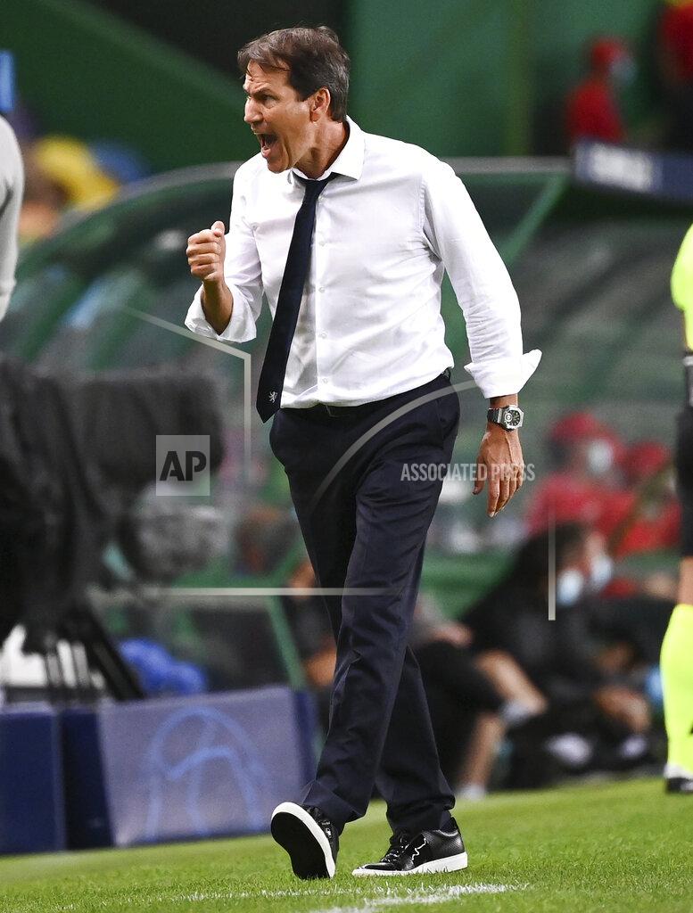 Franck Fife Lyon's head coach Rudi Garcia celebrates after his team's third goal during the Champions League quarterfinal match between Manchester City and Lyon at the Jose Alvalade stadium in Lisbon, Portugal, Saturday, Aug. 15, 2020. (Franck Fife/Pool Photo via AP)