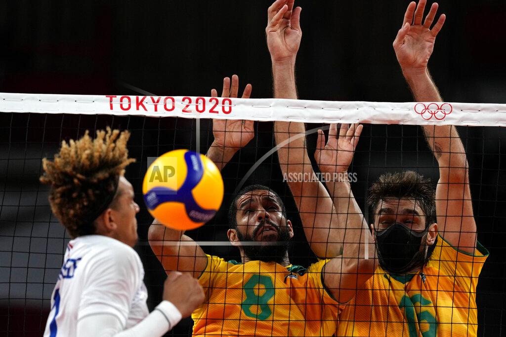 Frank Augstein France's Barthelemy Chinenyeze, from left, Brazil's Wallace De Souza and Brazil's Lucas Saatkamp challenge for the ball during the men's volleyball preliminary round pool B match between Brazil and France at the 2020 Summer Olympics, Sunday, Aug. 1, 2021, in Tokyo, Japan. (AP Photo/Frank Augstein)