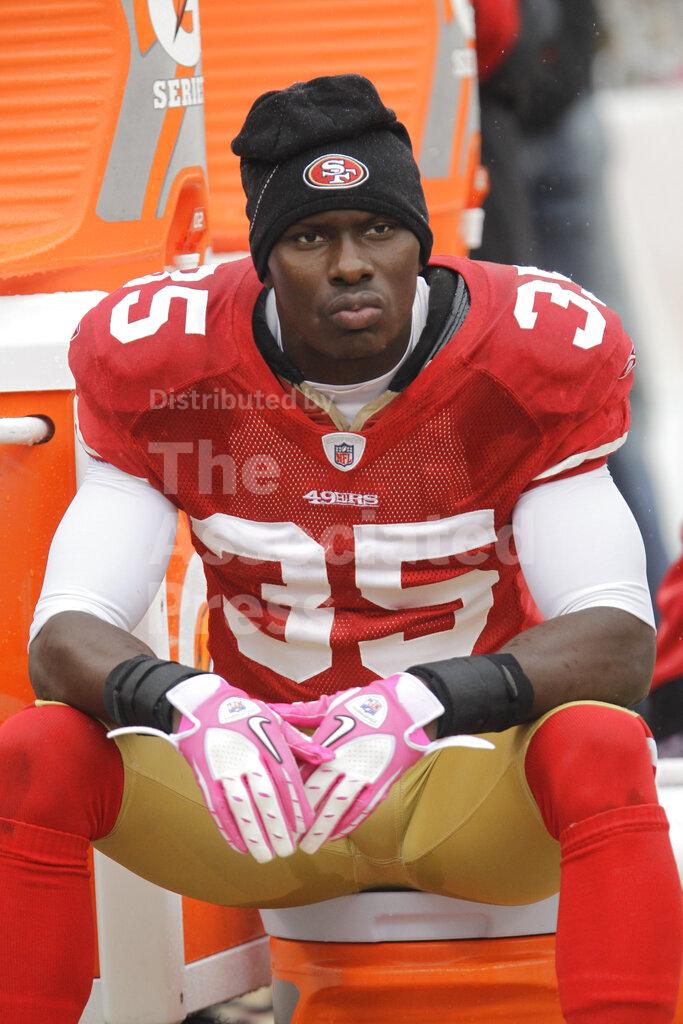 FILE - In this Oct. 17, 2010 file photo, San Francisco 49ers cornerback Phillip Adams (35) sits on the sideline during the first quarter of an NFL football game in San Francisco. A source briefed on a mass killing in South Carolina says the gunman who killed multiple people, including a prominent doctor, was the former NFL pro. The source tells AP that Adams shot himself to death early Thursday, April 8, 2021. (AP Photo/Paul Sakuma, File)