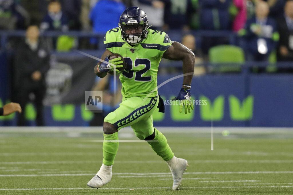 Stephen Brashear Seattle Seahawks running back Chris Carson rushes against the Los Angeles Rams during the second half of an NFL football game Thursday, Oct. 3, 2019, in Seattle. (AP Photo/Stephen Brashear)