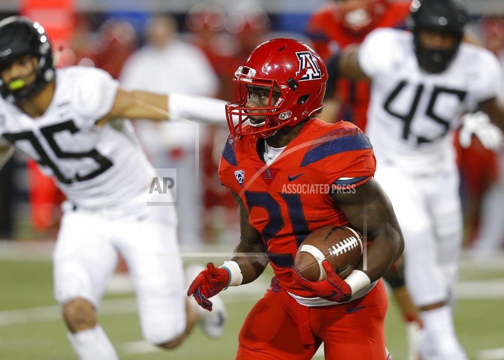 Rick Scuteri Arizona running back J.J. Taylor (21) runs for a first down in the second half during an NCAA college football game against Oregon, Saturday, Oct. 27, 2018, in Tucson, Ariz. Arizona defeated Oregon 44-15. (AP Photo/Rick Scuteri)