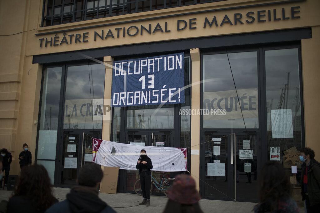 Daniel Cole Culture workers, actors, students, and theater employees attend a general assembly at the occupied Theatre de La Criee in Marseille, southern France, Friday, March 25, 2021. Out-of-work French culture and tourism workers are occupying theaters accross France to demand more government support after a year of pandemic that has devastated their incomes and put their livelihoods on indefinite hold. (AP Photo/Daniel Cole)