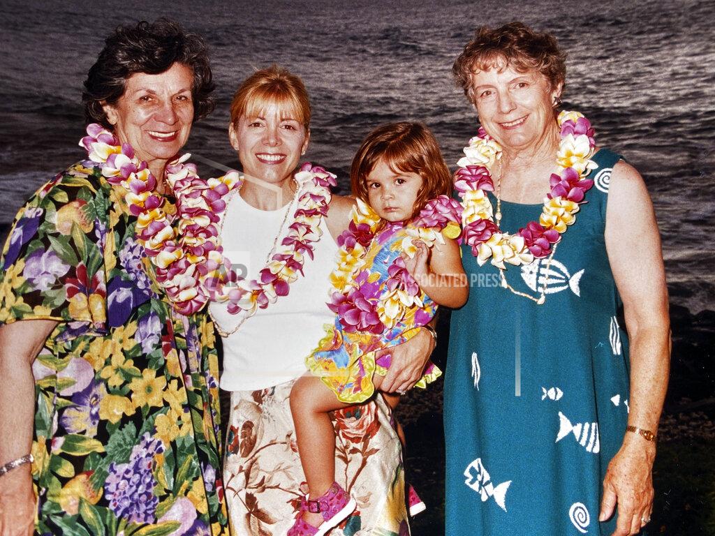 In this September 1999 photo provided by Sophia Eppolito, she poses for a photo while on vacation with from left, Julie Eppolito, Cindy Eppolito and Louise Delfino on the coast of Maui, Hawaii during a family vacation. In a wrenching coincidence that seemed made for 2020, journalist Sophia Eppolito lost both her grandmothers in four months last year. (Jim Eppolito via AP)