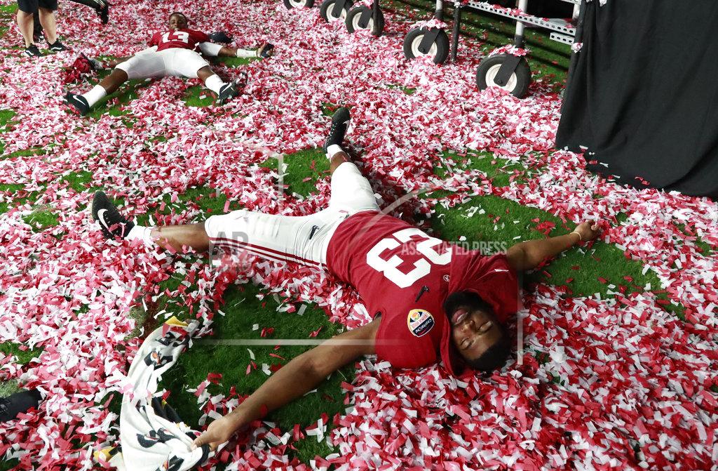 Wilfredo Lee Alabama long snapper Ryan Parris (53) plays with the confetti during the Orange Bowl NCAA college football game trophy presentation, Sunday, Dec. 30, 2018, in Miami Gardens, Fla. Alabama defeated Oklahoma 45-34. (AP Photo/Wilfredo Lee)
