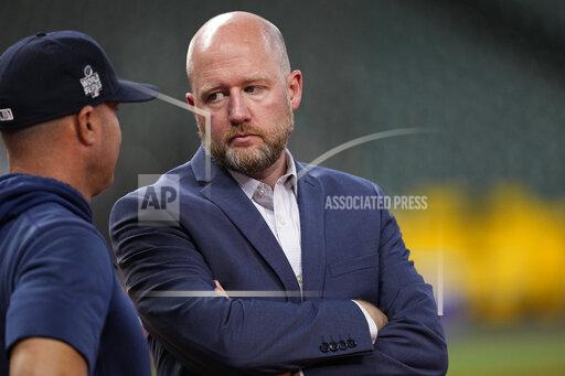 Houston Astros general manager James Click, right, talks with bench coach Joe Espada during batting practice before Game 1 in baseball's World Series against the Atlanta Braves Tuesday, Oct. 26, 2021, in Houston. (AP Photo/David J. Phillip)