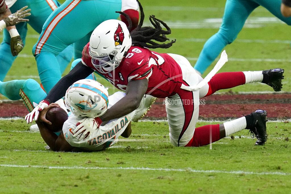 Ross D. Franklin Arizona Cardinals outside linebacker De'Vondre Campbell (59) sacks Miami Dolphins quarterback Tua Tagovailoa (1) during the second half of an NFL football game, Sunday, Nov. 8, 2020, in Glendale, Ariz. (AP Photo/Ross D. Franklin)