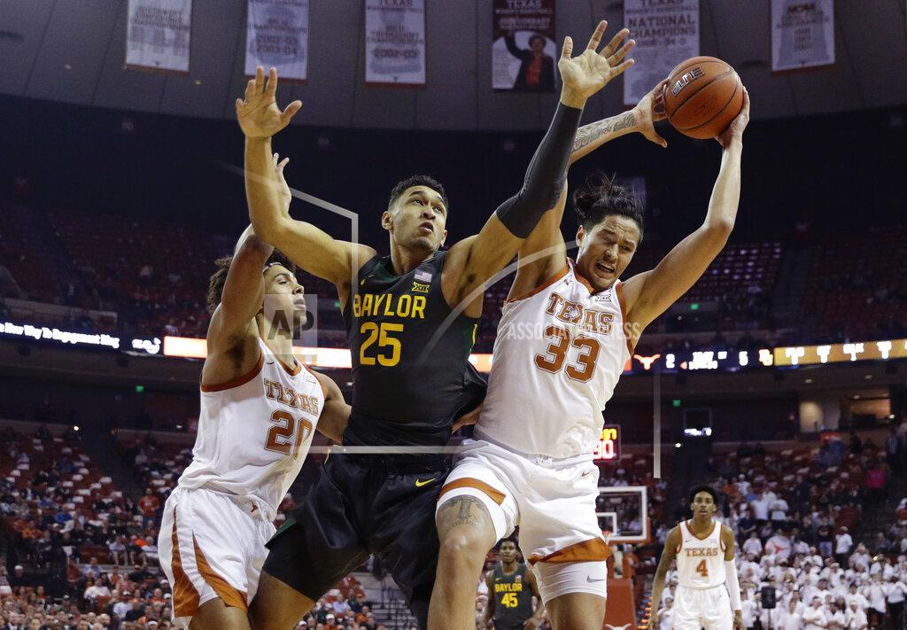 Eric Gay Baylor forward Tristan Clark (25) battles Texas forwards Kamaka Hepa (33) and Jericho Sims (20) for a rebound during the first half of an NCAA college basketball game, Monday, Feb. 10, 2020, in Austin, Texas. (AP Photo/Eric Gay)