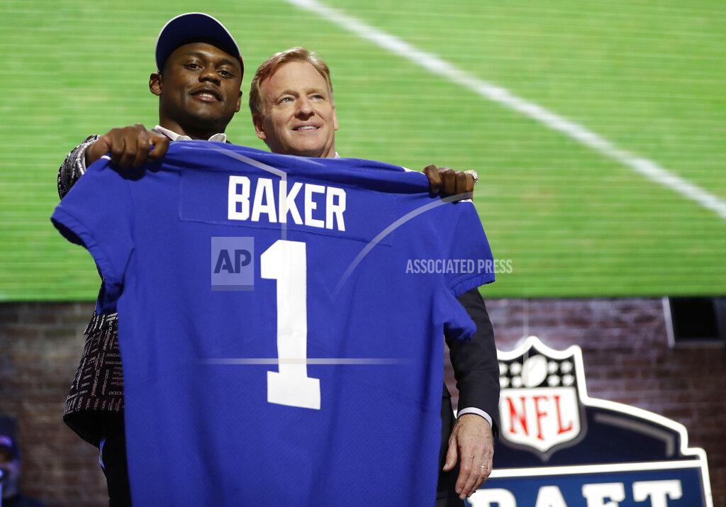 Mark Humphrey Georgia defensive back DeAndre Baker poses with NFL Commissioner Roger Goodell after the New York Giants selected Baker in the first round at the NFL football draft, Thursday, April 25, 2019, in Nashville, Tenn. (AP Photo/Mark Humphrey)