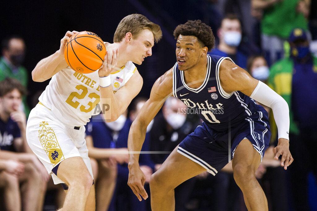 Robert Franklin Notre Dame's Dane Goodwin (23) gets pressure from Duke's Wendell Moore Jr. (0) during the first half of an NCAA college basketball game Monday, Jan. 31, 2022, in South Bend, Ind. (AP Photo/Robert Franklin)