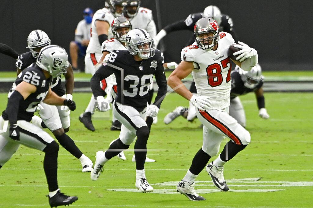 David Becker Tampa Bay Buccaneers tight end Rob Gronkowski (87) runs against Las Vegas Raiders strong safety Jeff Heath (38) during the first half of an NFL football game, Sunday, Oct. 25, 2020, in Las Vegas. (AP Photo/David Becker)