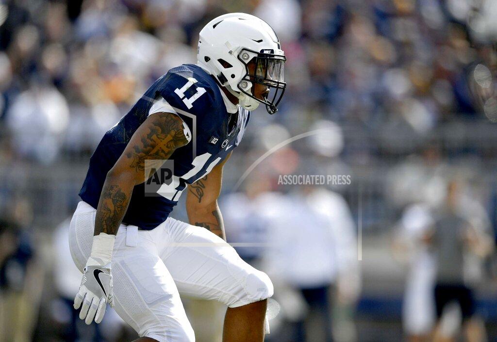 Abby Drey FILE - In this April 21, 2018, file photo, Penn State linebacker Micah Parsons follows a player during the NCAA college football game's Blue-White Game on in State College, Pa. Last year, Parsons put together the greatest freshman season for a linebacker in Penn State’s long history. He says he learned that earning a starting spot takes more than making a bunch of tackles. (Abby Drey/Centre Daily Times via AP, File)