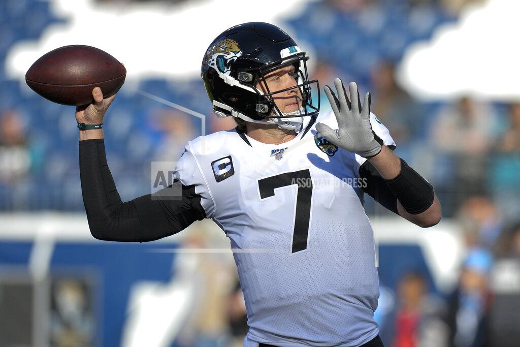 Mark Zaleski FILE - In this Nov. 24, 2019, file photo, Jacksonville Jaguars quarterback Nick Foles warms up before an NFL football game against the Tennessee Titans in Nashville, Tenn. A person familiar with the trade says the Jacksonville Jaguars have agreed to send quarterback Nick Foles to the Chicago Bears for a compensatory fourth-round draft pick. The person spoke to The Associated Press on condition of anonymity because trades don't become official until the league year begins later Wednesday, March 18, 2020. (AP Photo/Mark Zaleski, File)
