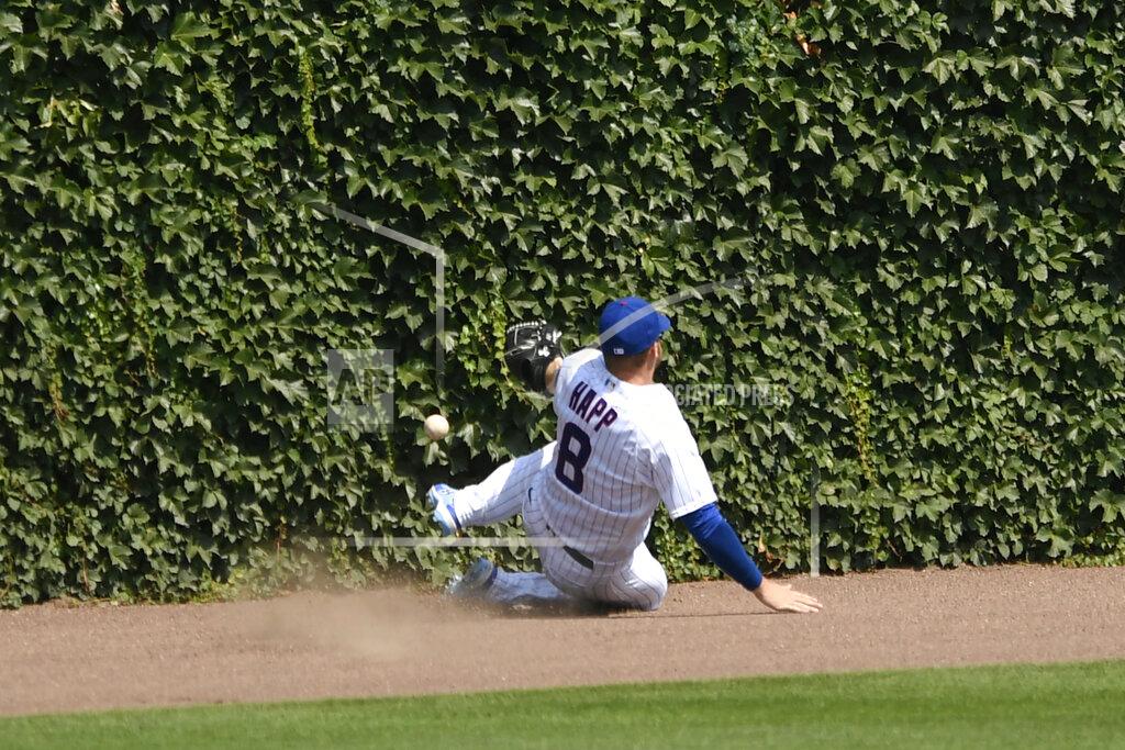 Paul Beaty Chicago Cubs center fielder Ian Happ (8) misses an RBI-double by Milwaukee Brewers' Omar Narvaez during the seventh inning of a baseball game Saturday, July 25, 2020, in Chicago. (AP Photo/Paul Beaty)